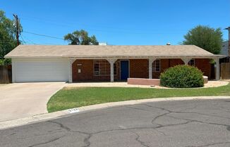BEAUTIFUL RED BRICK HOME ON A LARGE CUL-DE-SAC LOT NEAR THE CAMELBACK ROAD.