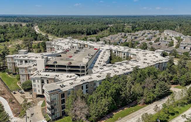 an aerial view of a city with buildings and trees