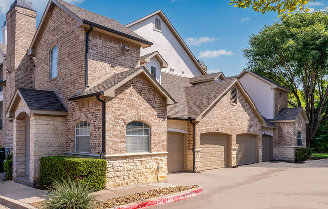 a house with two garages and a driveway