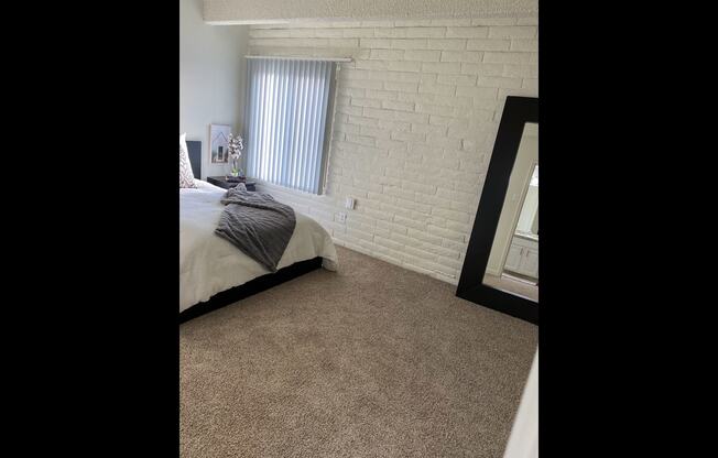 This is a photo of the bedroom in the 965 square foot 1 bedroom, 1 bath  apartment at Harvard Square Apartments, in the Vickery Meadow neighborhood of Dallas, TX.