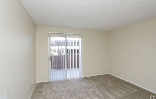 Downstairs bedroom sliding glass door to balcony