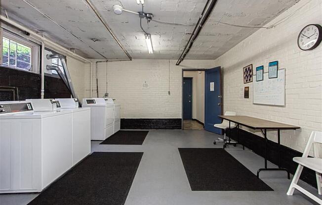 laundry room at 1400 van buren apartments in washington dc
