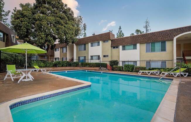 our apartments offer a swimming pool with chairs and umbrellas