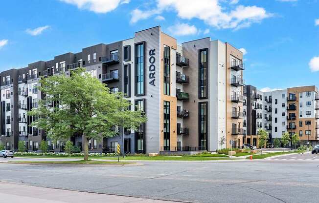 Apartment complex named ARDOR with a street in front.