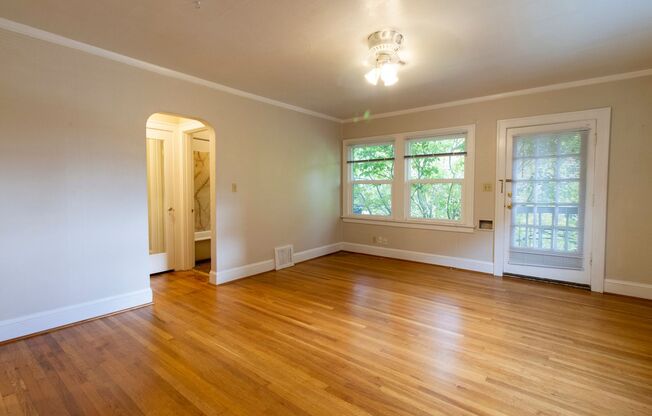 Bright One Bedroom Unit in Fourplex with Vintage Appeal, Original Hardwoods and Garage Available!