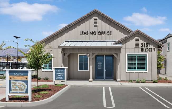 a building with a leasing office on the side of it at Solstice at Fiddyment Ranch, California, 95747