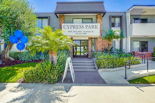 The front of a building with the name Cypress Park on it.
