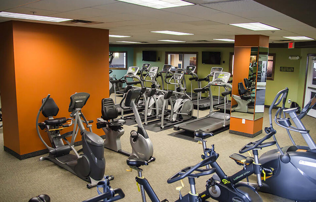 a room filled with lots of exercise bikes