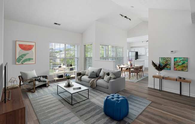 a living room with white walls and hardwood flooring