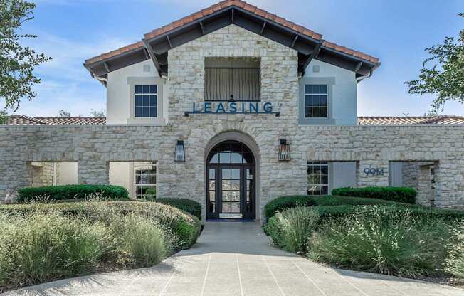 The building has a sign that says "Leasing" on it.