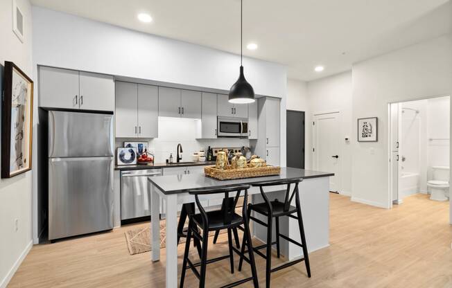 Fitted Kitchen With Island Dining at The Hill Apartments, Saint Paul, MN, 55103