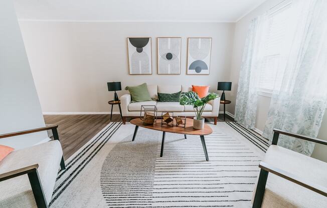 Roomy living room with bright light Living Room at Midtown Oaks Townhomes in Mobile, AL