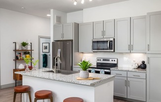 High-End Kitchen with Granite Counters and Stainless Steel Appliances