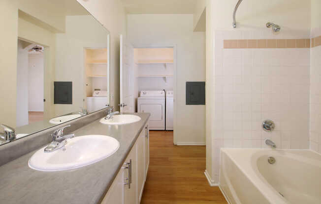 Bathroom with Double Vanity and In-home Washer and Dryer