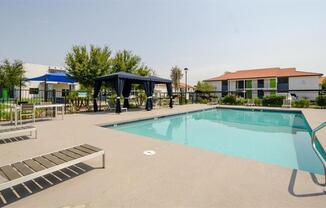 Mesa Apartments for Rent - Mesa Station - Sparkling Pool with Lounge Seating, Umbrellas, and Picnic Tables