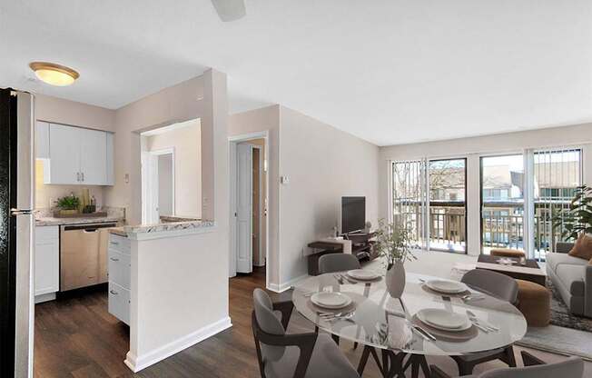 A modern kitchen with a dining table set for four.