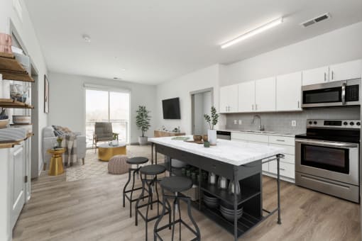 a kitchen and living room in an apartment at The Waterford At Rocketts Landing Apartments, PRG Real Estate, Richmond, Virginia