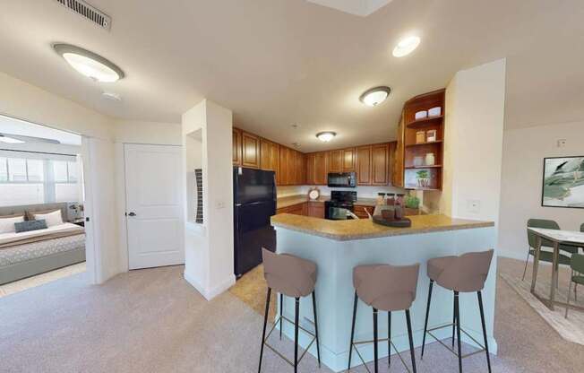 a kitchen with a bar and a living room