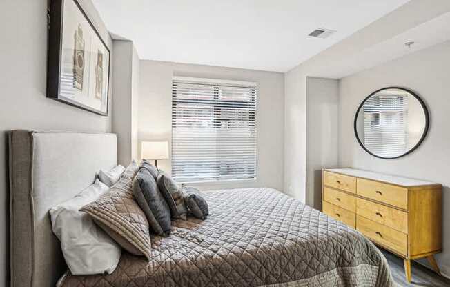 a bedroom with a large bed and a window