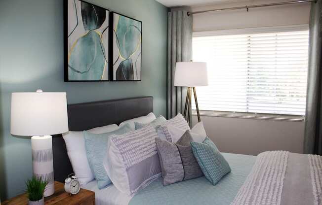 large window in bedroom with model furniture and decor  at Huntsville Landing Apartments, Alabama