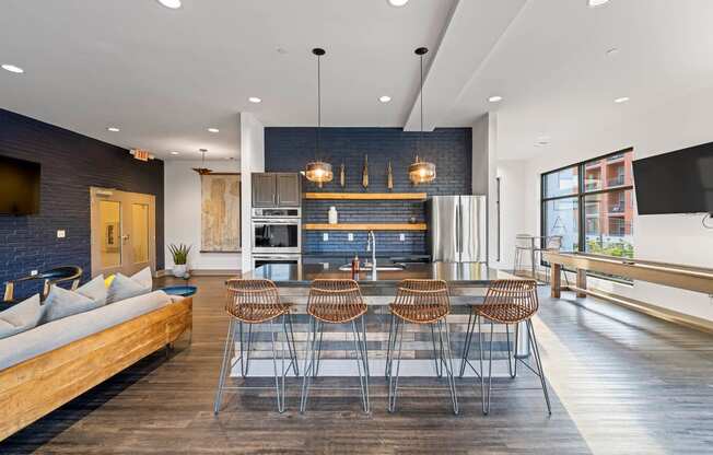 a kitchen and dining room with a table and chairs