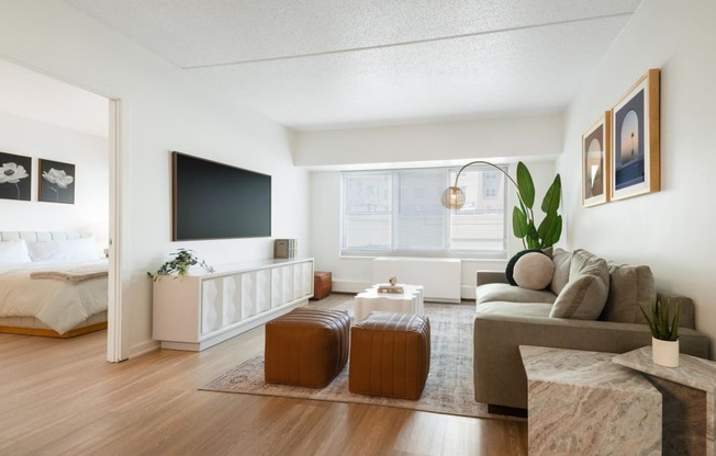 a living room with a couch and a table and a television