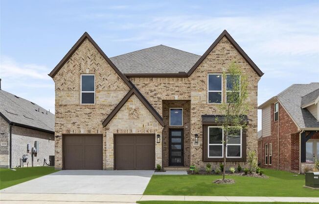 Absolutely beautiful front elevation. The drive up appeal on this home is stunning.