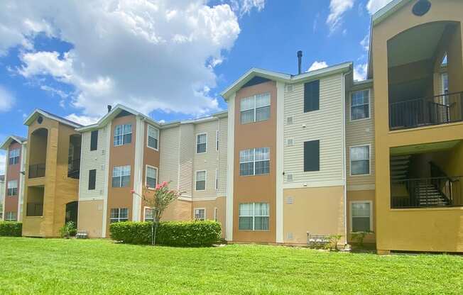 the outlook of an apartment building on a sunny day