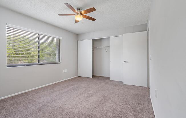 a bedroom with a large window