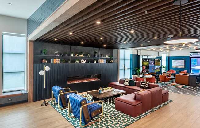 A modern living room with a wooden ceiling and a black wall.