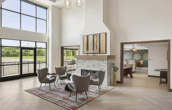 a living room with a fireplace and a dining room in the background