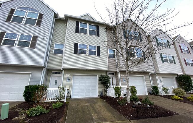 Fantastic Townhome with Gas Fireplace, Deck, Fenced Yard, and Vaulted Ceilings