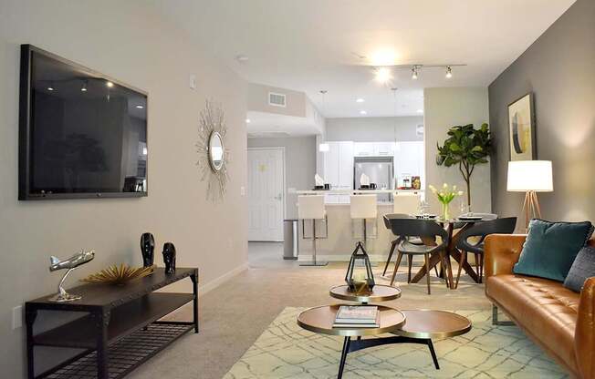 A living room with a brown couch and a coffee table.