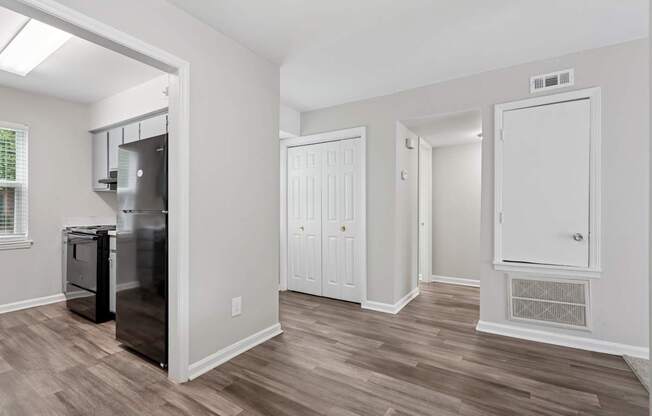 A kitchen area with a fridge, a dishwasher and a stove.