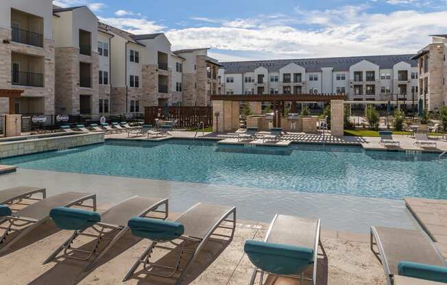 Swimming Pool And Sundeck at McCarty Commons, San Marcos, Texas