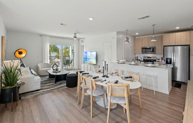 a kitchen and dining room with a table and chairsat Altis Grand Suncoast, Land O' Lakes Florida