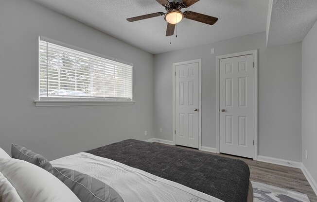 Unwind in the comfort of this spacious bedroom at Icon Downtown Durham, complete with natural light, stylish fixtures, and ample storage. Ideal for relaxation and a good night's sleep. Schedule your tour today to see your future home!