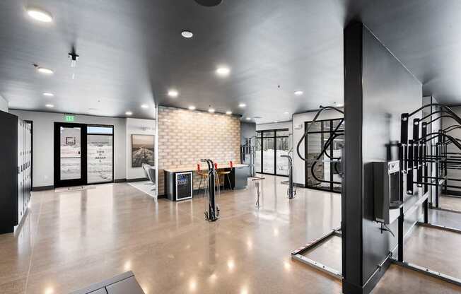 A modern gym with a variety of equipment.