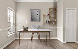 A room with a table, a chair, and a shelf with a picture frame on the wall.