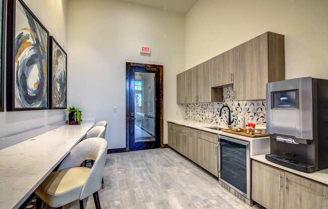 a kitchen with a refrigerator freezer and a sink