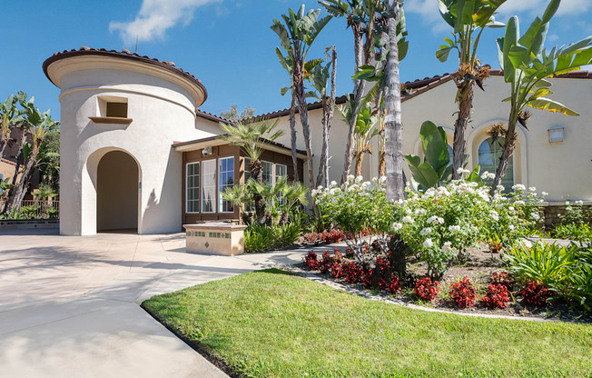 a house with palm trees in the background