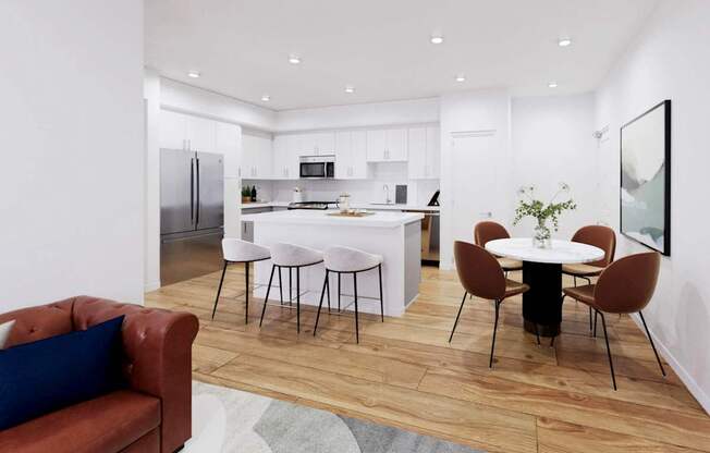 A modern kitchen with a dining table set for four at The Villas at Anacapa Canyon, Camarillo, 93012