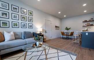 a living room with a couch and a table at Sonder Fields in Happy Valley, OR