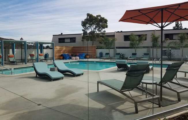 Outdoor pool area with lounge chairs