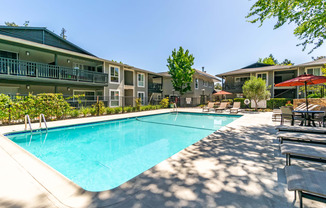 our apartments offer a swimming pool with our apartment buildings in the background