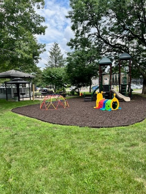 a playground in a park on a sunny day