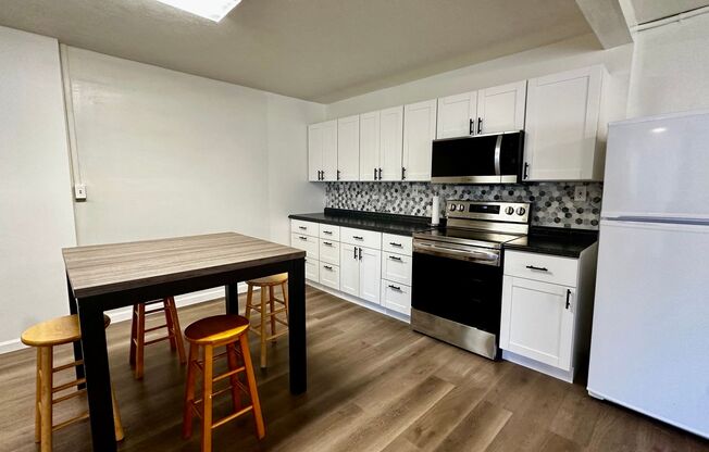 Available NOW - Highly Desired 2 BED 2 BATH with Den in lush Manoa Valley!