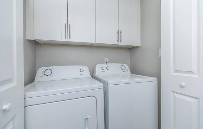 a kitchen with a sink and a refrigerator