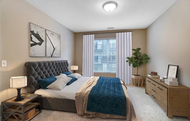 an empty bedroom with a bed and a window