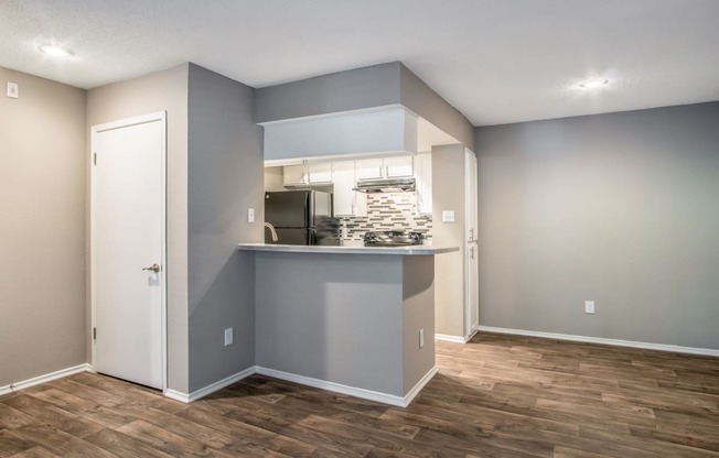 Kitchen and Dining Area at The Players Club Apartments in Nashville, TN